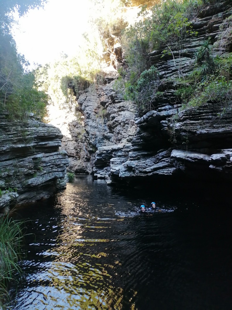 Guided kloofing adventure in Wilderness featuring cliff jumping and river swimming.